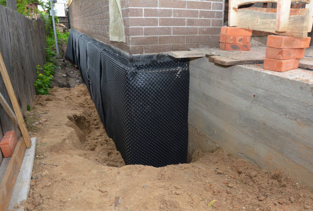 Happy homeowners after waterproofing job in Ecorse